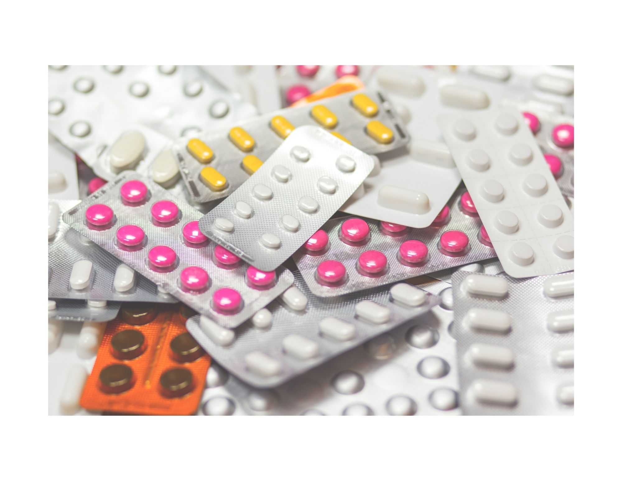a bunch of different kinds and colours of pill medications