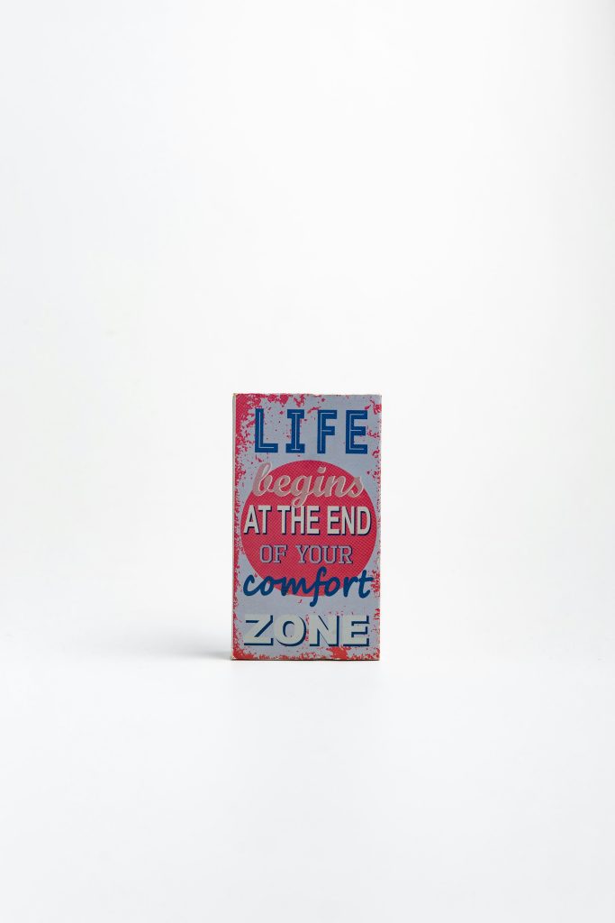 Picture of book saying Life Begins at the end of your comfort zone - Photo by Zhivko Monkov on Unsplash